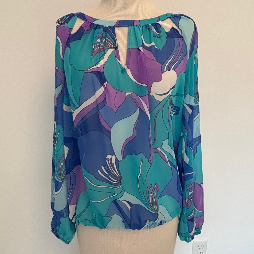 Jennifer Lopez sheer V cutout top purple blue teal S